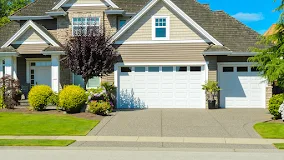 New white garage door installation on residential home in Oklahoma City OK by Affordable Door Co